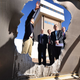Steven Chu views a half-inch thick sheet of aluminum that was melted in 23 seconds by a beam of concentrated sunlight from 105 heliostats at the National Solar Thermal Test Facility.